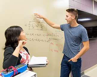 student showing a math problem to a professor