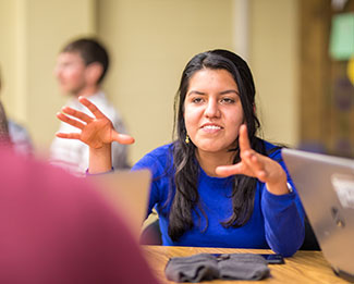 student talking to another student