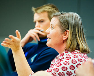 woman talking in class
