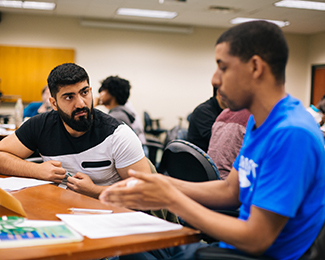 two students talking to each other