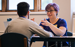 Professor Tara Kishbaugh talking with a student