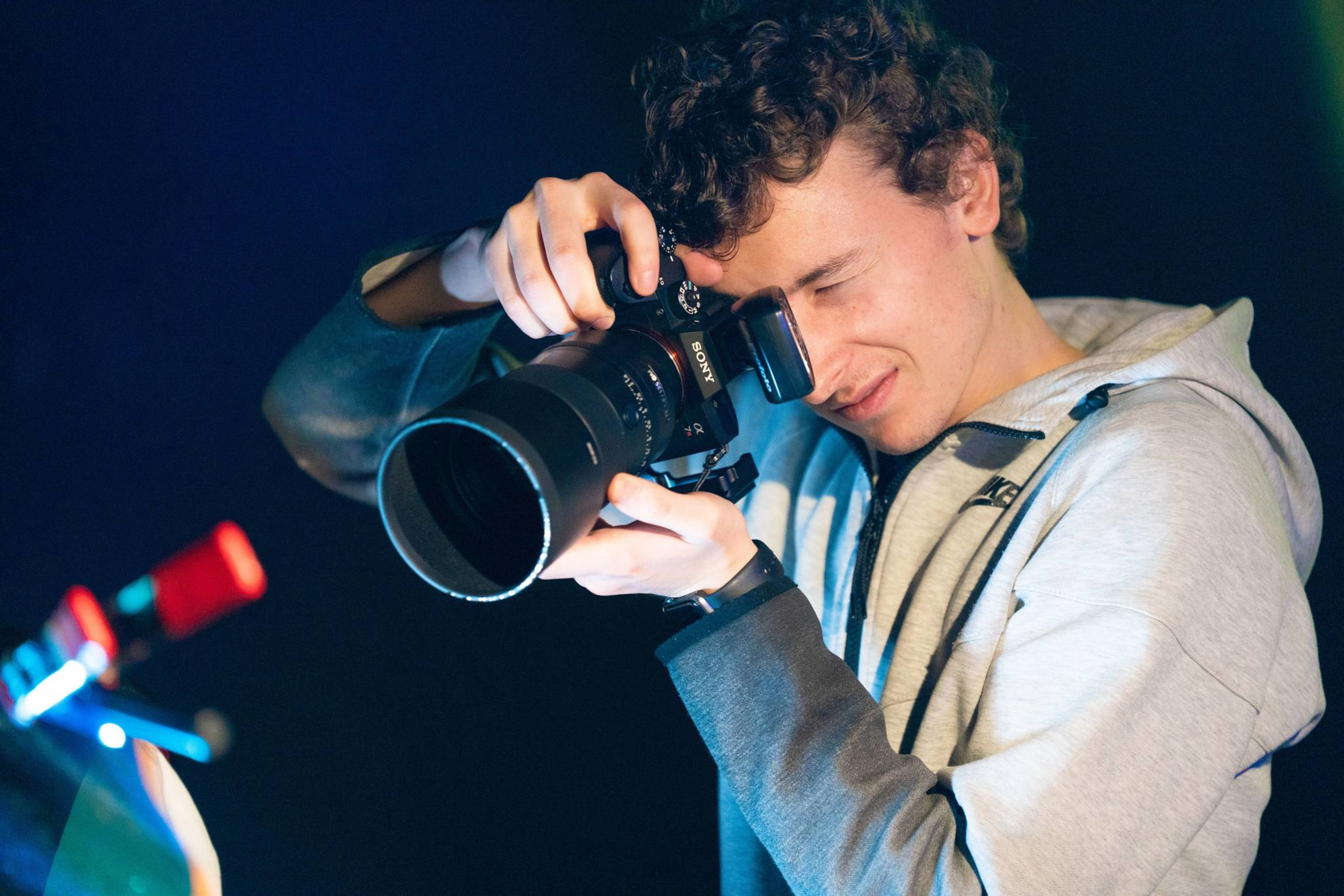 Student with camera Camera photography lens